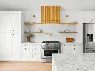 White Kitchen With Gray Tiles and Warm Wood Accents