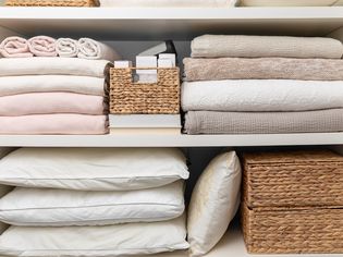 Small linen closet organization