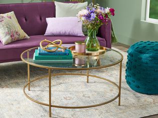 Modern round coffee table with gold accents