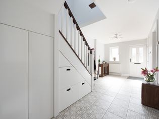 Hallway with staircase storage