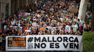 Protesters hold a banner reading “Mallorca is not for sale” during a demonstration last week against the “massification” of tourism and housing prices on the island
