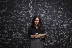 Woman on a tablet with math chalkboard