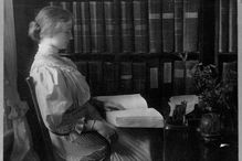 Writer Helen Keller Holding Braille Book in Study