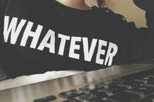 Woman wearing a shirt that says "whatever"