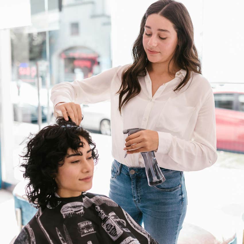 woman getting her hair cut 