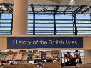 A label on bookshelves in a library that reads: History of the British Isles.