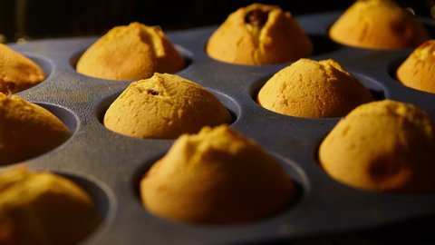 Muffins. Baking in oven. Time lapse footage of cooking Cupcakes, 4k, UHD 스톡 비디오