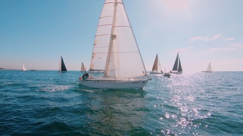 Regatta or sailing race at mediterannean sea. Sunny summer day, happy and excited people on sailboat or yacht. Amazing idea for summer holiday. Travel destination 스톡 비디오