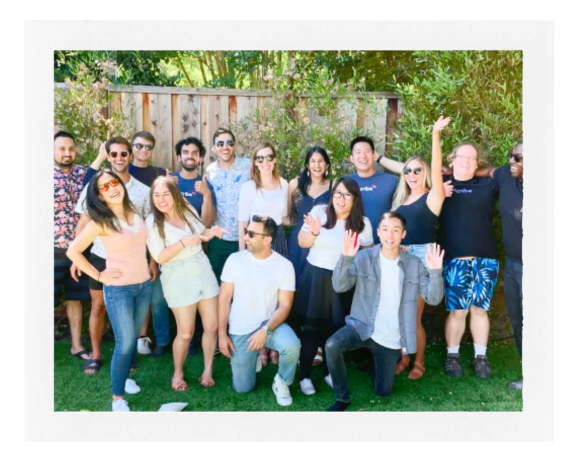 A photo of the Scribe team celebrating their company anniversary in a backyard.