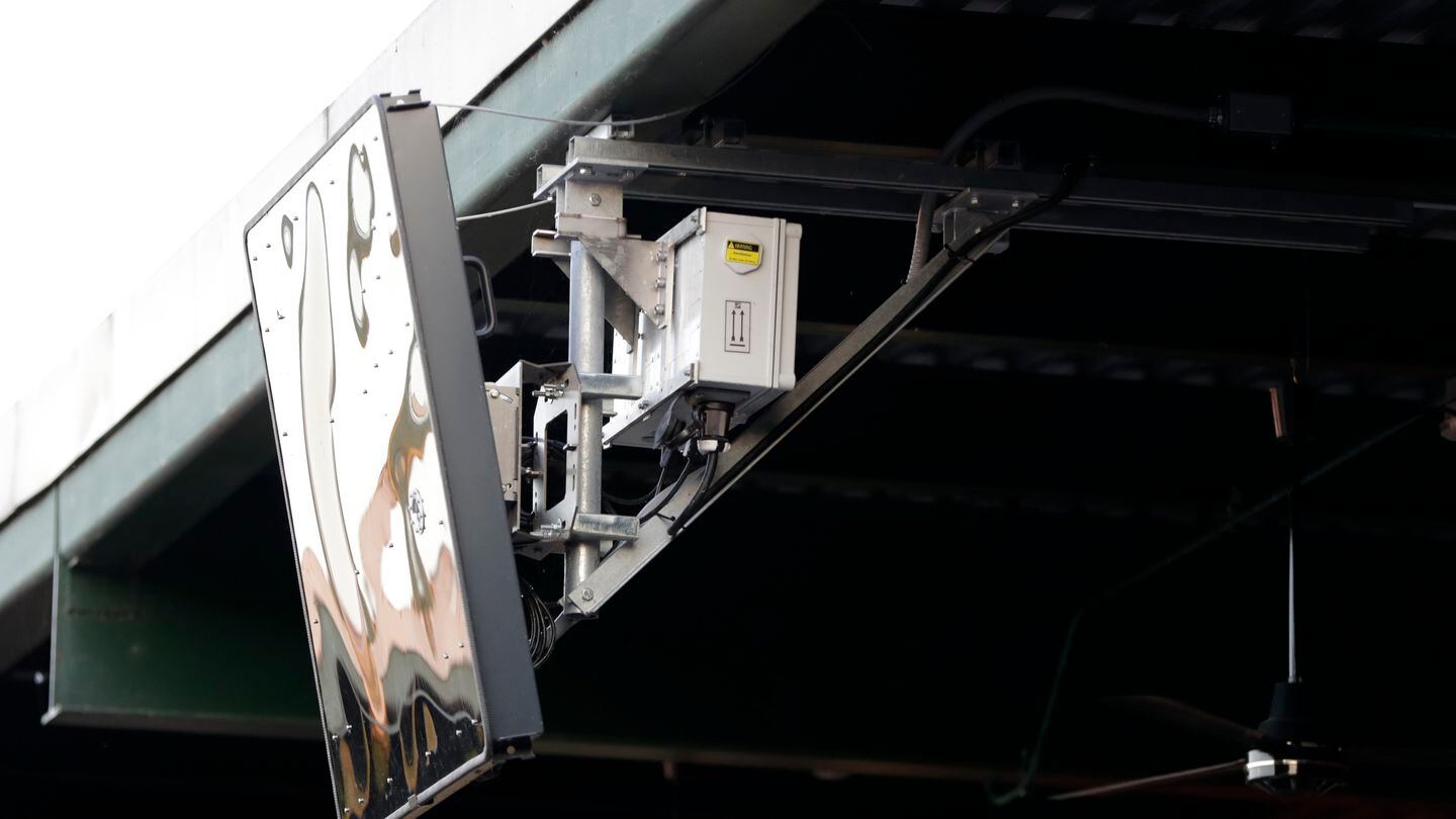 A radar device is seen on the roof behind home plate at PeoplesBank Park during the third inning of an Atlantic League All-Star minor league baseball game in York, Pa. Baseball's top minor leagues are switching to a challenge system full-time for their test of robot umpires. Major League Baseball has been experimenting with the automated ball-strike system in the minor leagues since 2019.