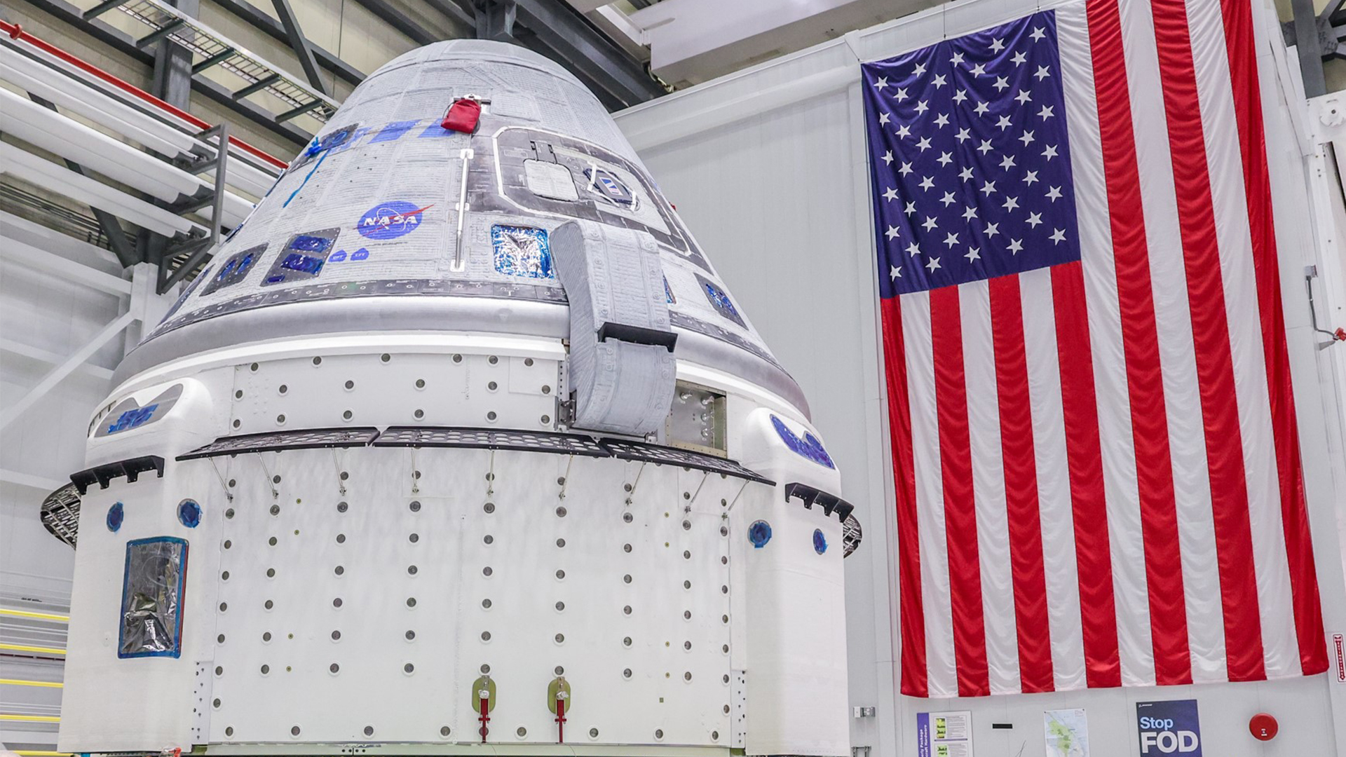 Crew Flight Test vehicle shown in April prior to going into the Hazardous Processing Area in the Commercial Crew and Cargo Processing Facility.