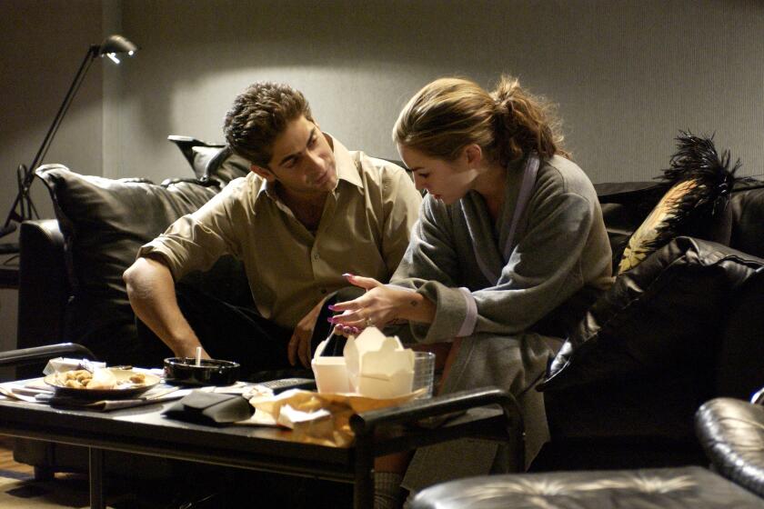 Michael Imperioli as Christopher, left, and Drea de Matteo as Adriana in an episode of "The Sopranos" in 2004.