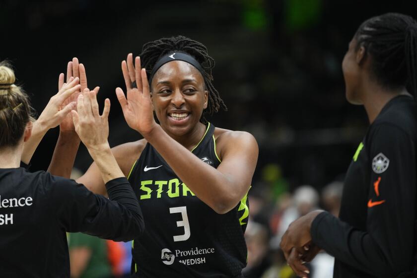 Seattle Storm forward Nneka Ogwumike greets guard Sami Whitcomb, left, before a WNBA basketball game against the Washington Mystics, Saturday, May 25, 2024, in Seattle. (AP Photo/Lindsey Wasson)