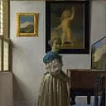 Johannes Vermeer - A Young Woman standing at a Virginal