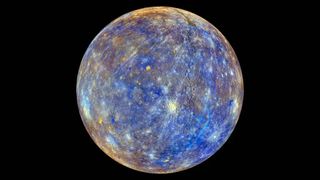 mercury appears as a speckled blue, yellow, gray rock against a black backdrop of space and covered in craters.