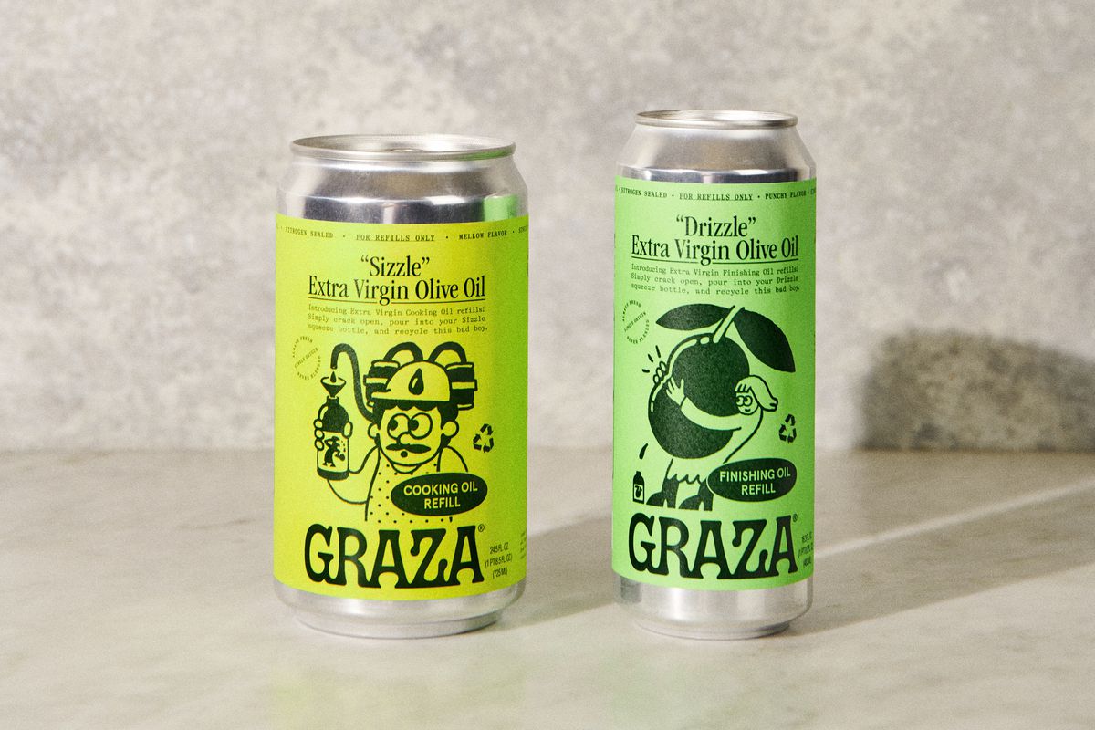 a studio shot showing two cans of olive oil, meant for refilling bottles from the brand Graza. the wider can on the left has a yellow-green label and contains “Sizzle” olive oil. the skinnier can on the right has a pistachio-green label and contains “Drizzle” olive oil.