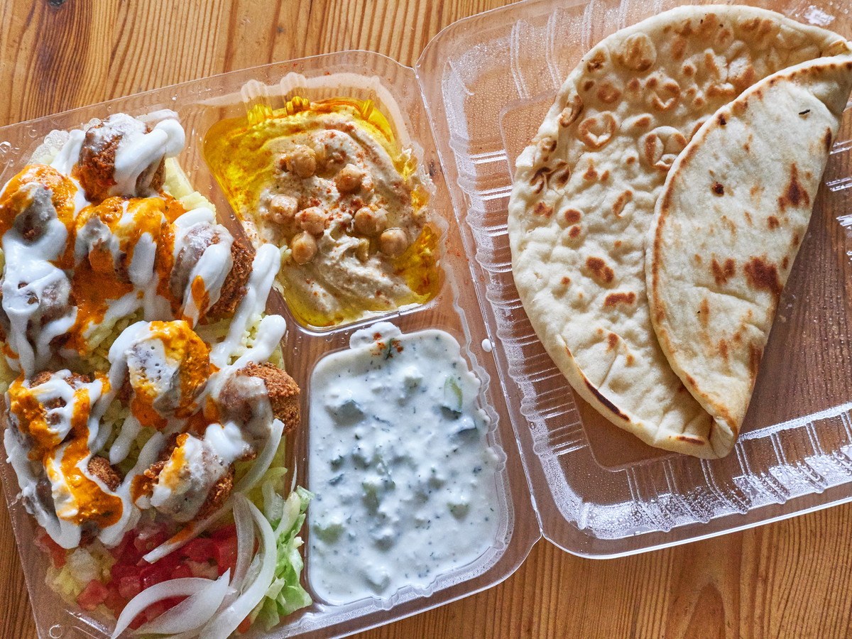 A takeout plate of falafels, hummus, and pita bread from Gyro Kingdom.