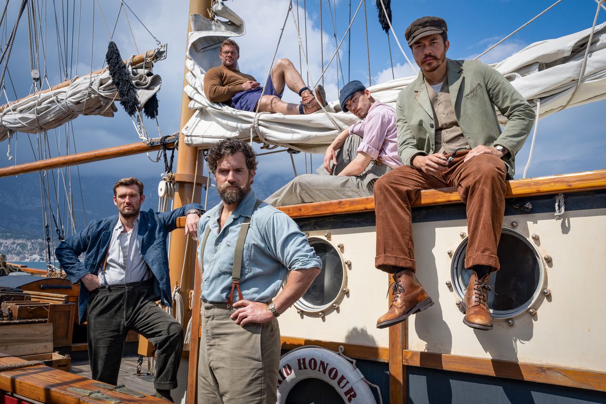 The cast of The Ministry of Ungentlemanly Warfare (Henry Cavill, Alan Ritchson, Alex Pettyfer, Henry Godling, Hero Fiennes Tiffin) lounge on a boat.