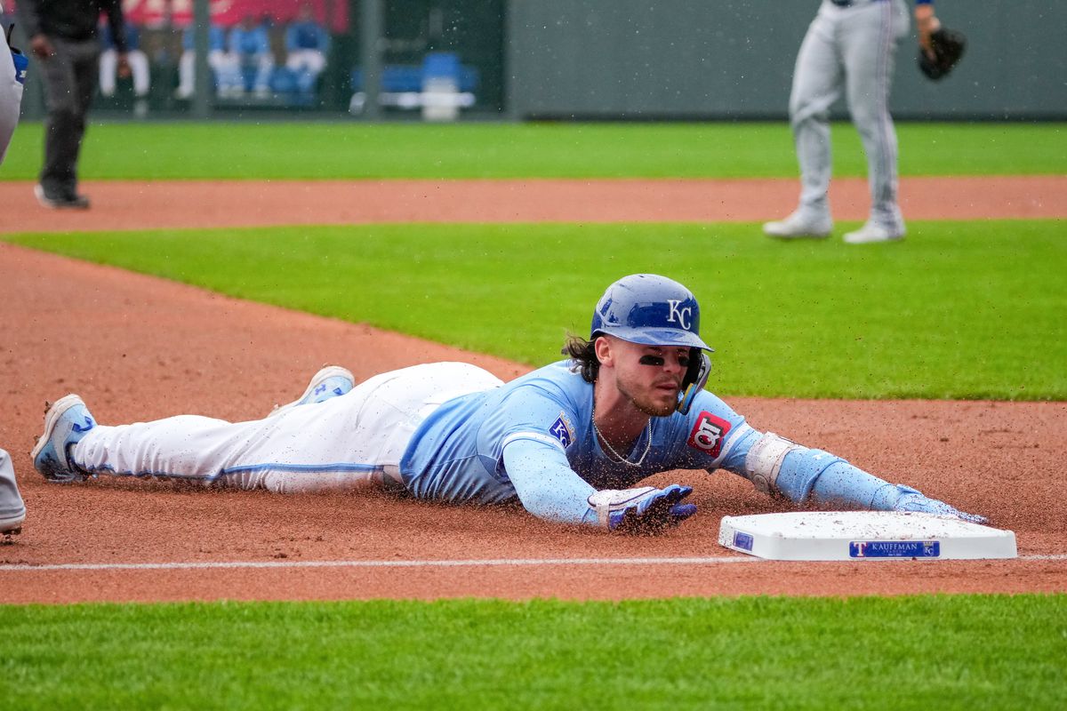 Kansas City Royals shortstop Bobby Witt Jr. (7) slides into third safely against the Texas Rangers after hitting a triple in the first inning at Kauffman Stadium. Mandatory Credit: Denny Medley