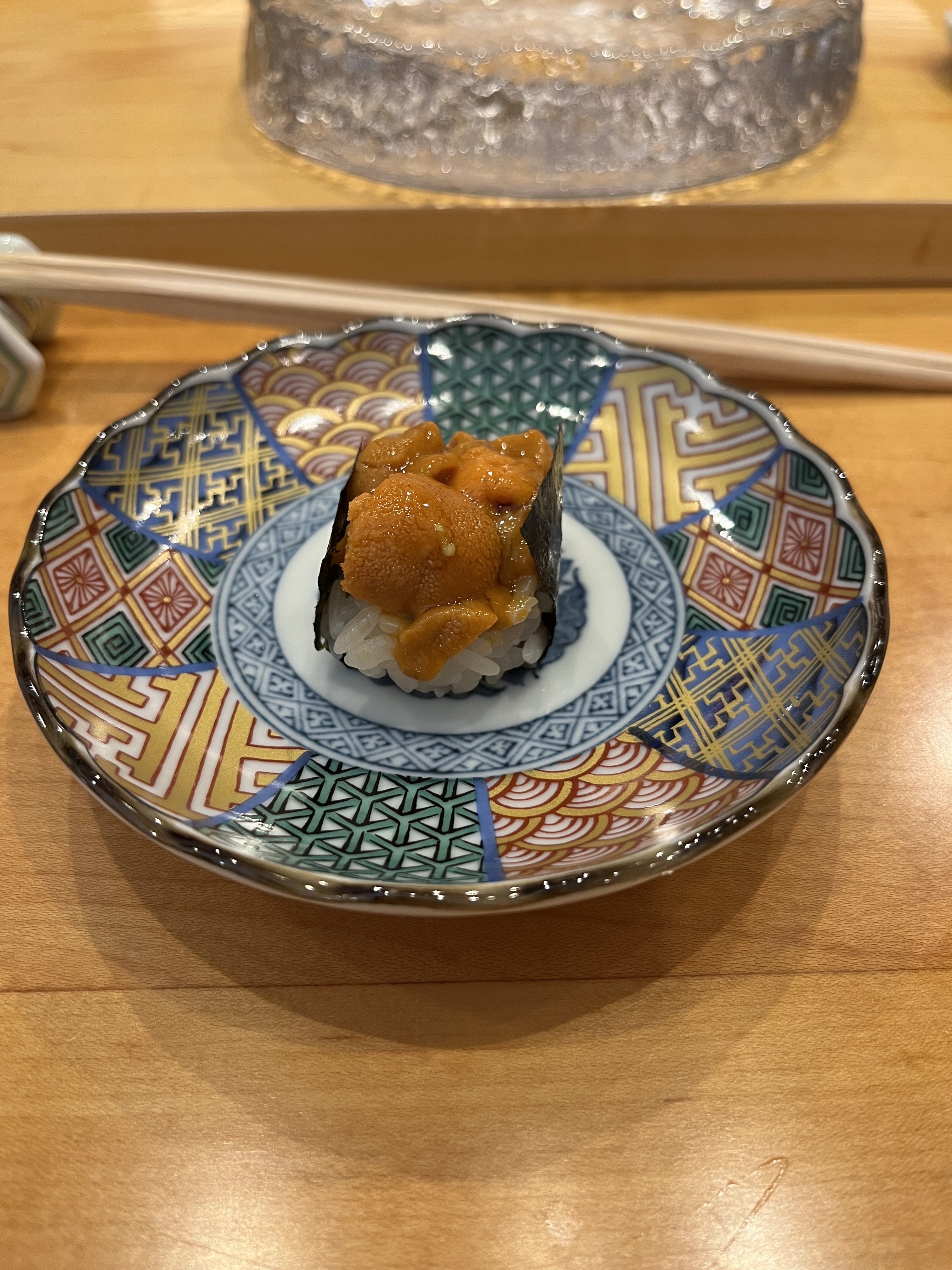 A piece of sushi on a plate.