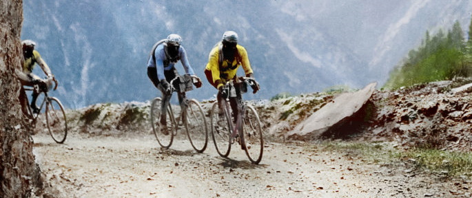 Tour de France 1912, somewhere between Nice and Grenoble. The image has been colourised and an anachronistic yellow jersey added.