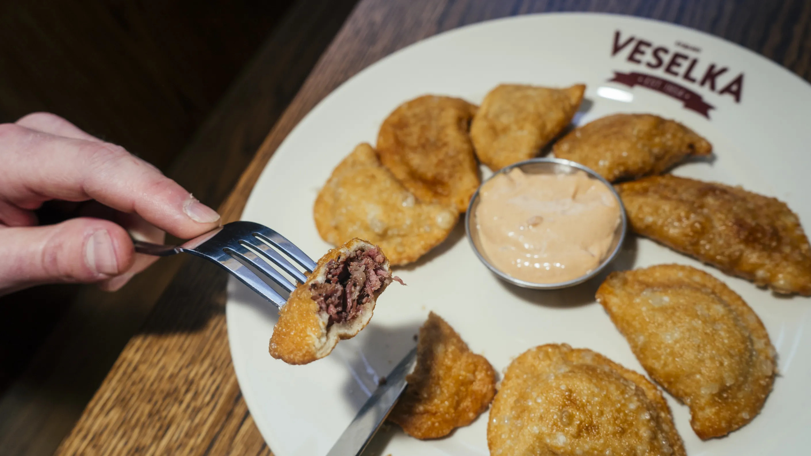 A plate of fried pierogies with pastrami at Veselka.