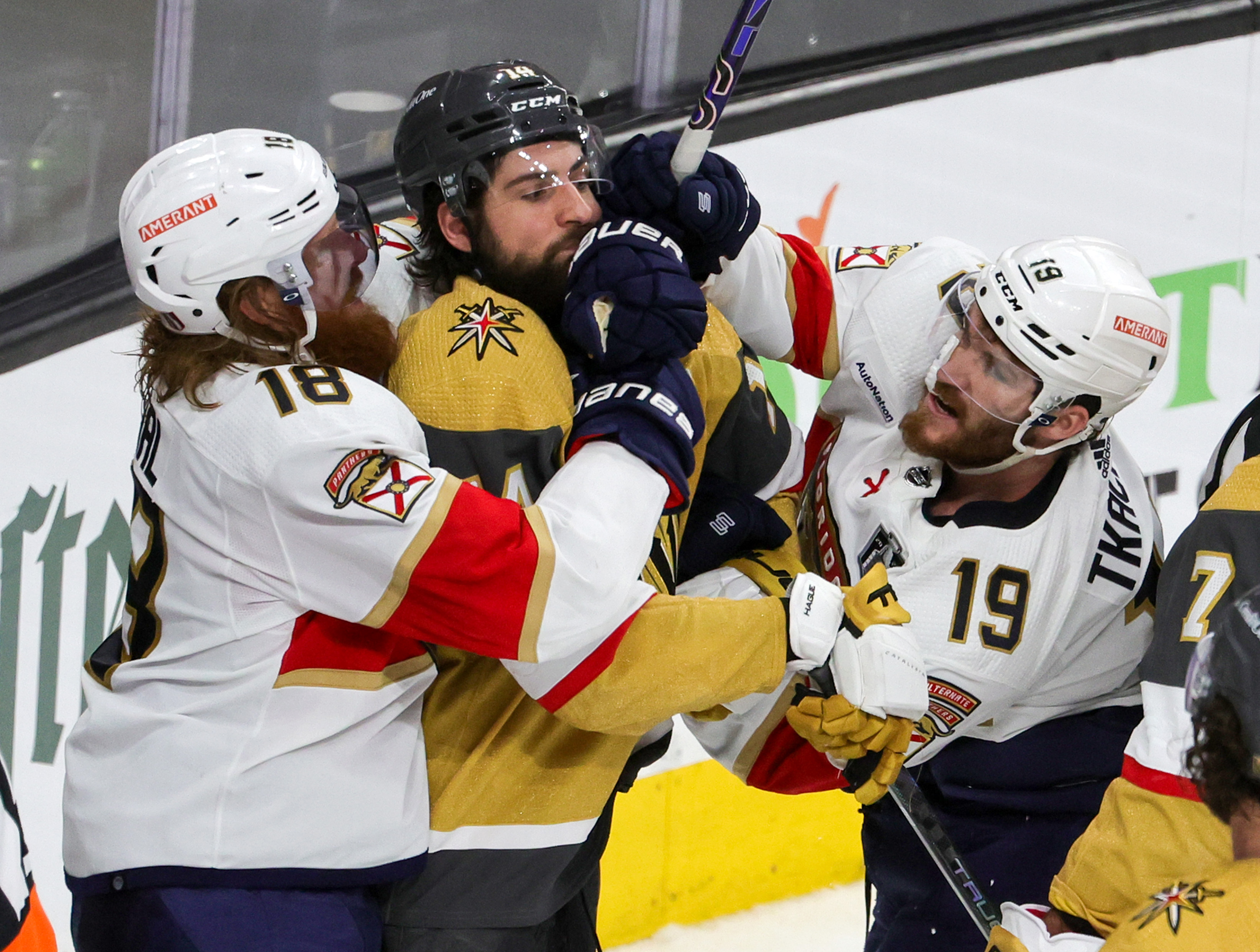Marc Staal and Matthew Tkachuk of the Florida Panthers fight with Nicolas Hague of the Vegas Golden Knights in the third period of Game One of the 2023 NHL Stanley Cup Final at T-Mobile Arena on June 03, 2023 in Las Vegas, Nevada. The Golden Knights defeated the Panthers 5-2.