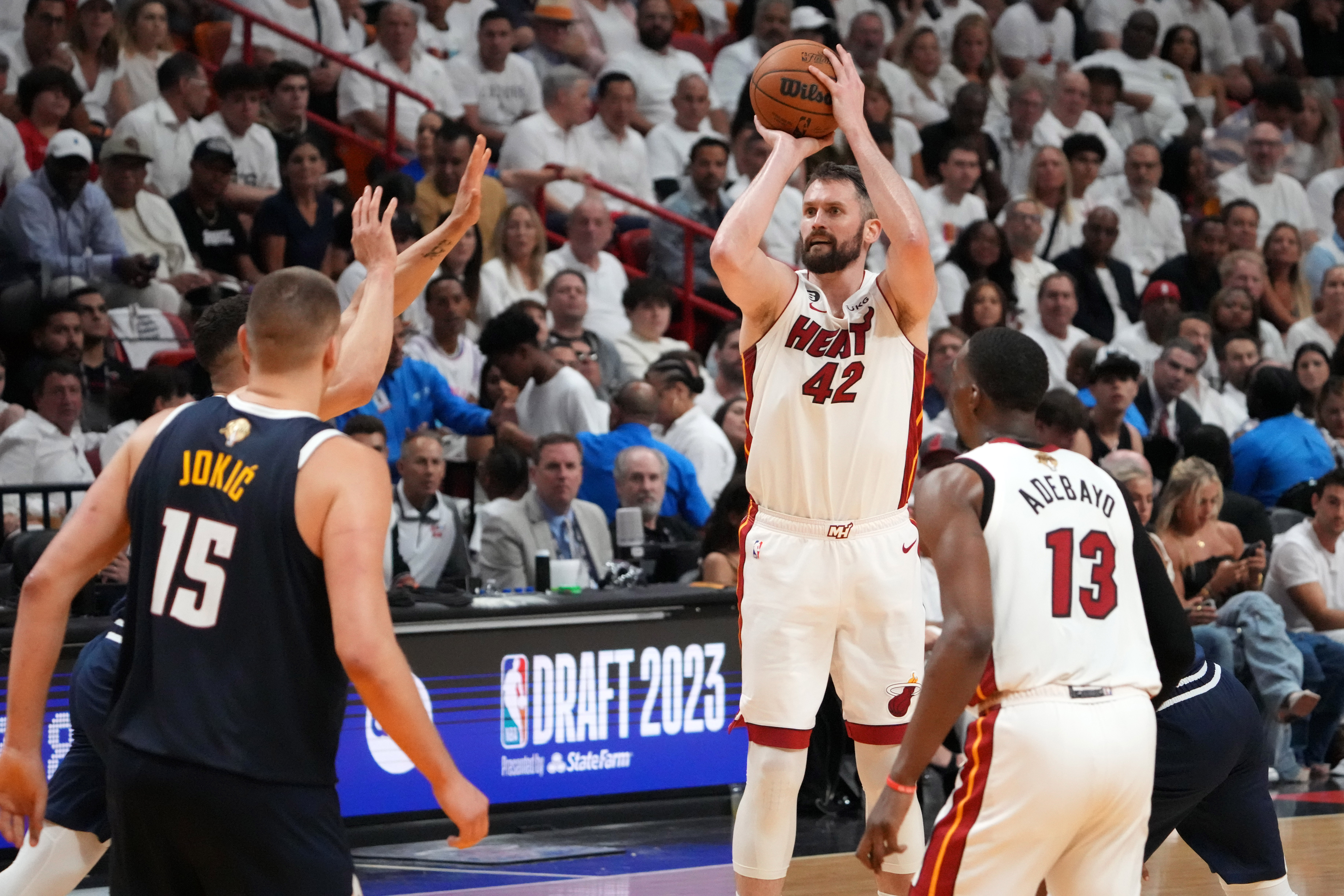 Miami Heat forward Kevin Love (42) shoots the ball against the Denver Nuggets during the third quarter in game four of the 2023 NBA Finals at Kaseya Center.