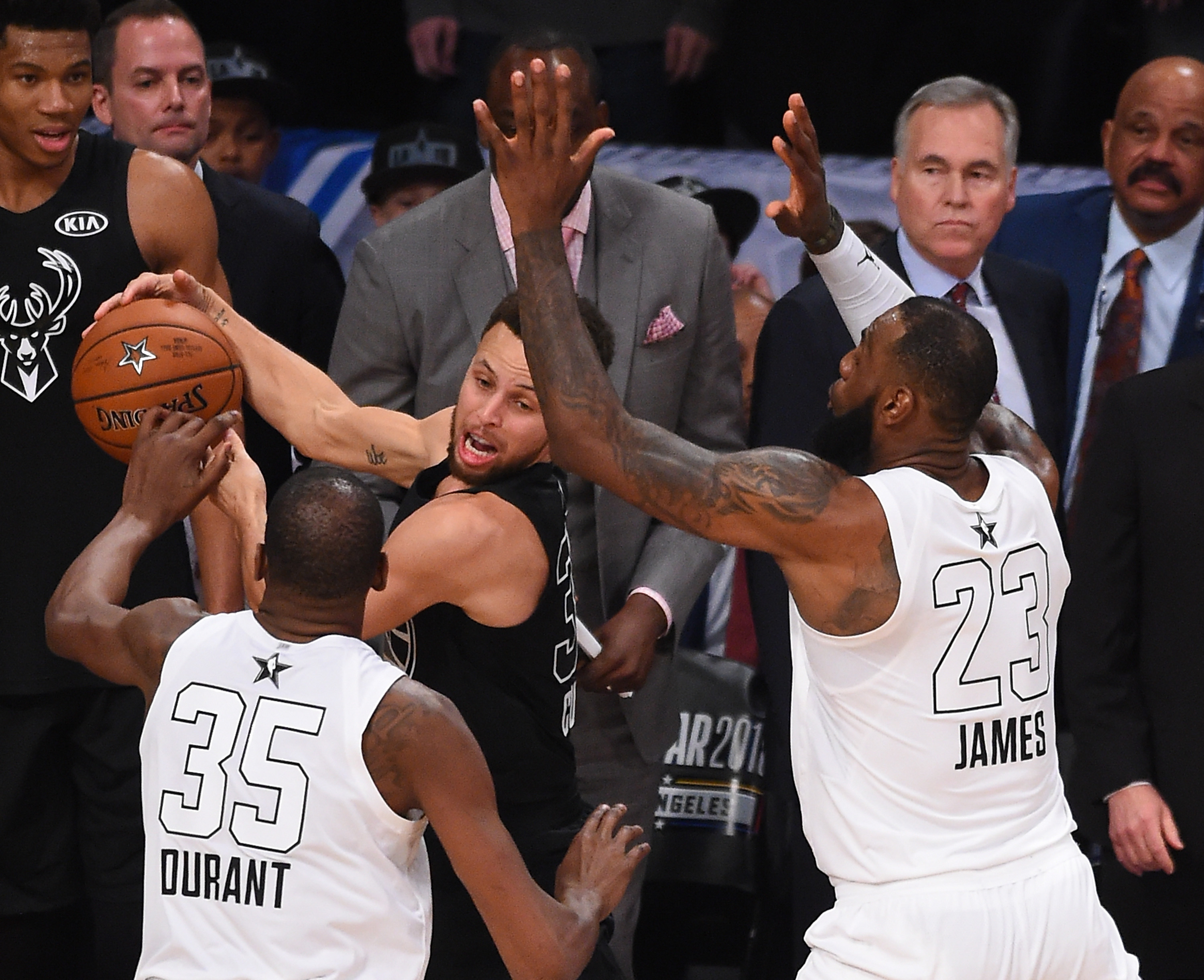 Steph Curry trapped by LeBron James and Kevin Durant in the All-Star Game. 