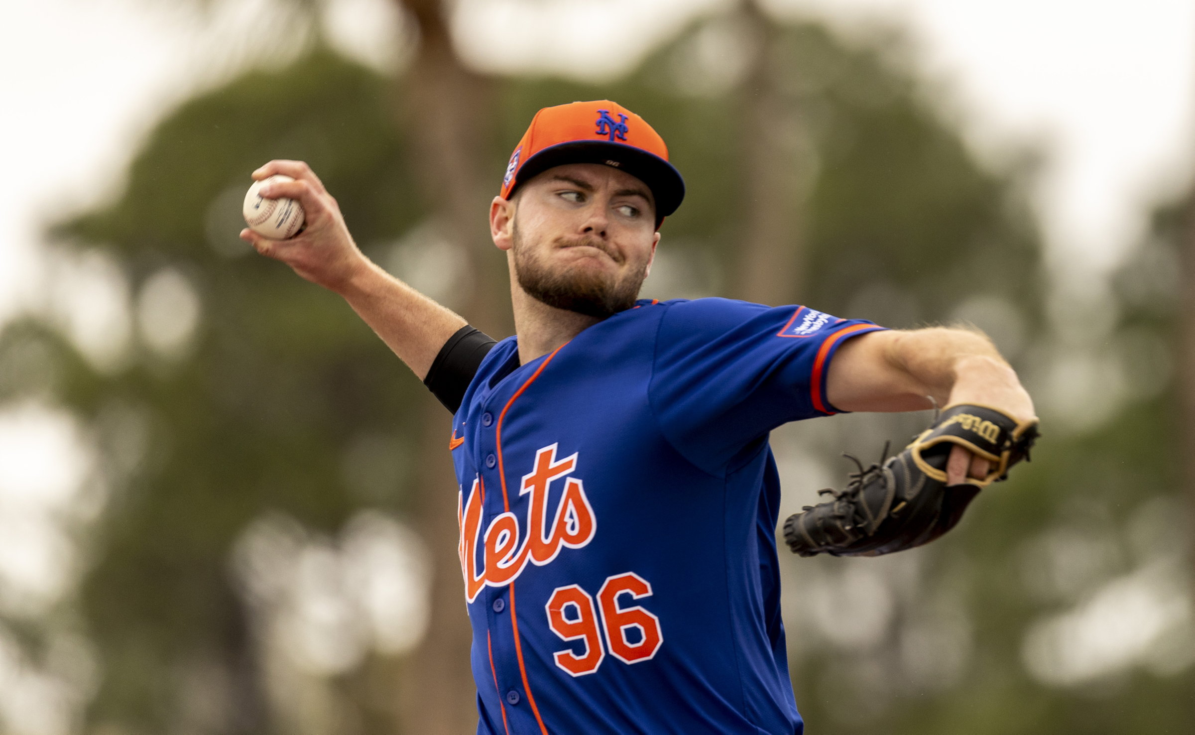 New York Mets pitcher Christian Scott throws during spring training camp in Port St. Lucie, Fl.