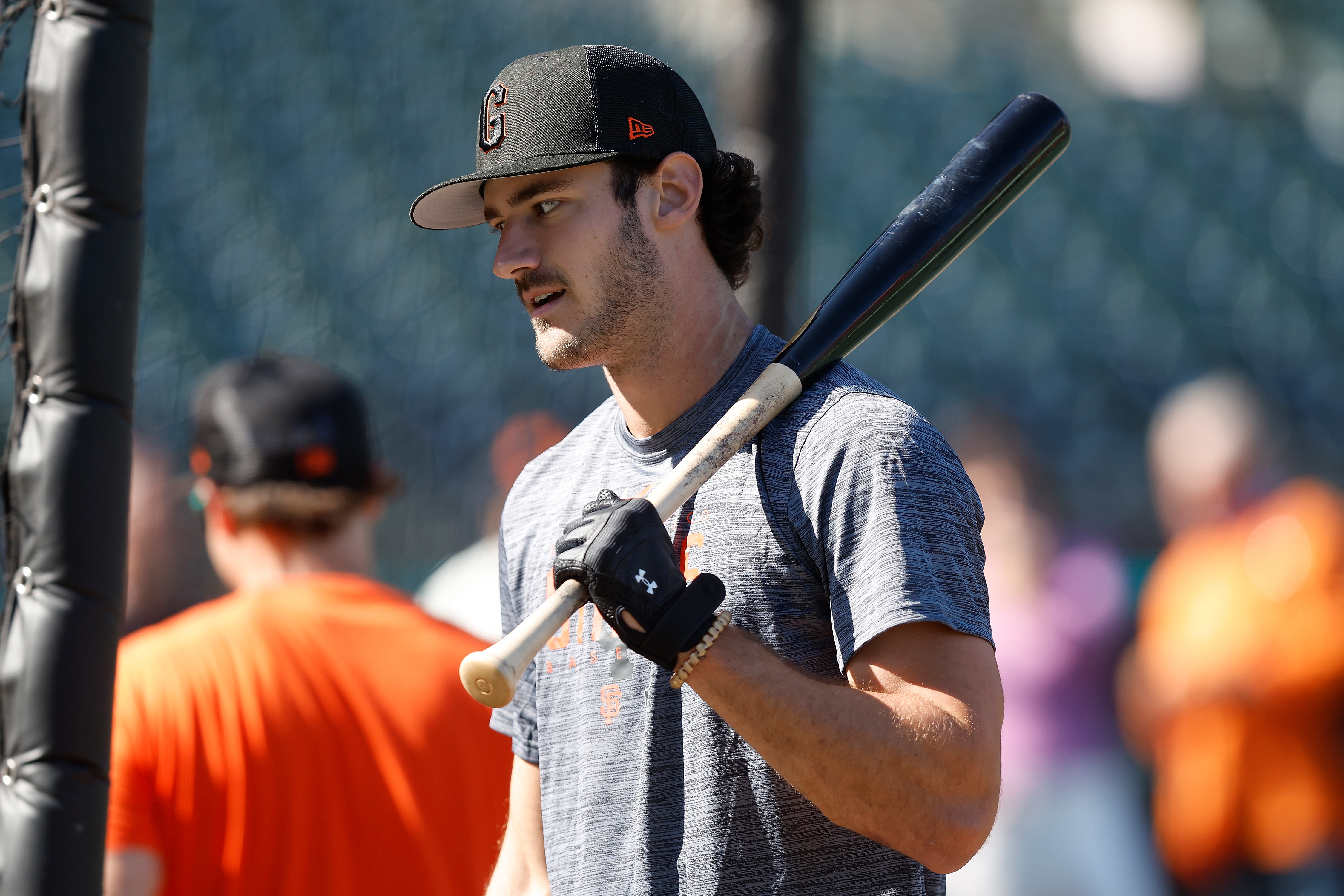 Bryce Eldridge resting a bat on his shoulder during batting practice.