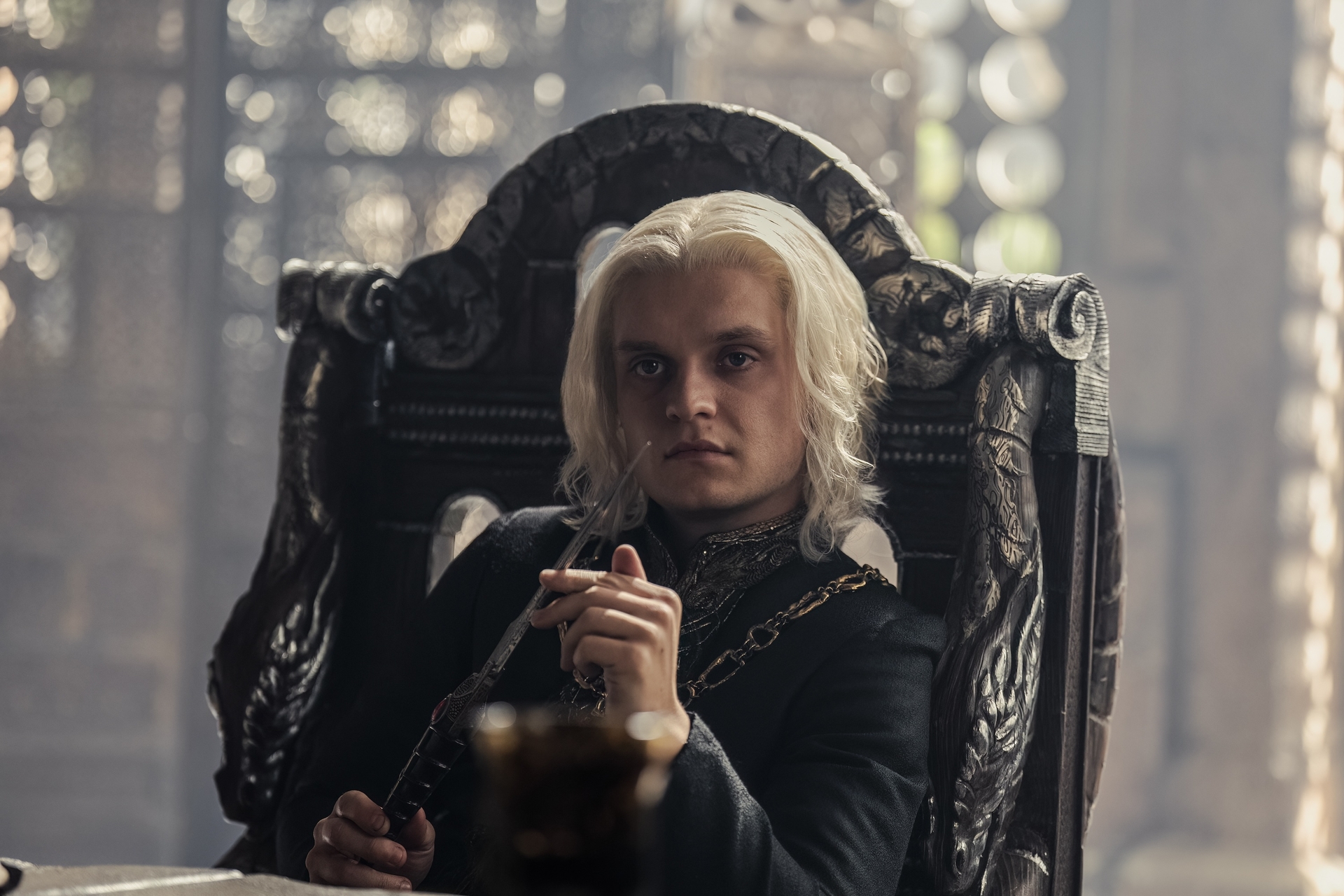 Aegon II lounges on a throne in House of the Dragon season 2