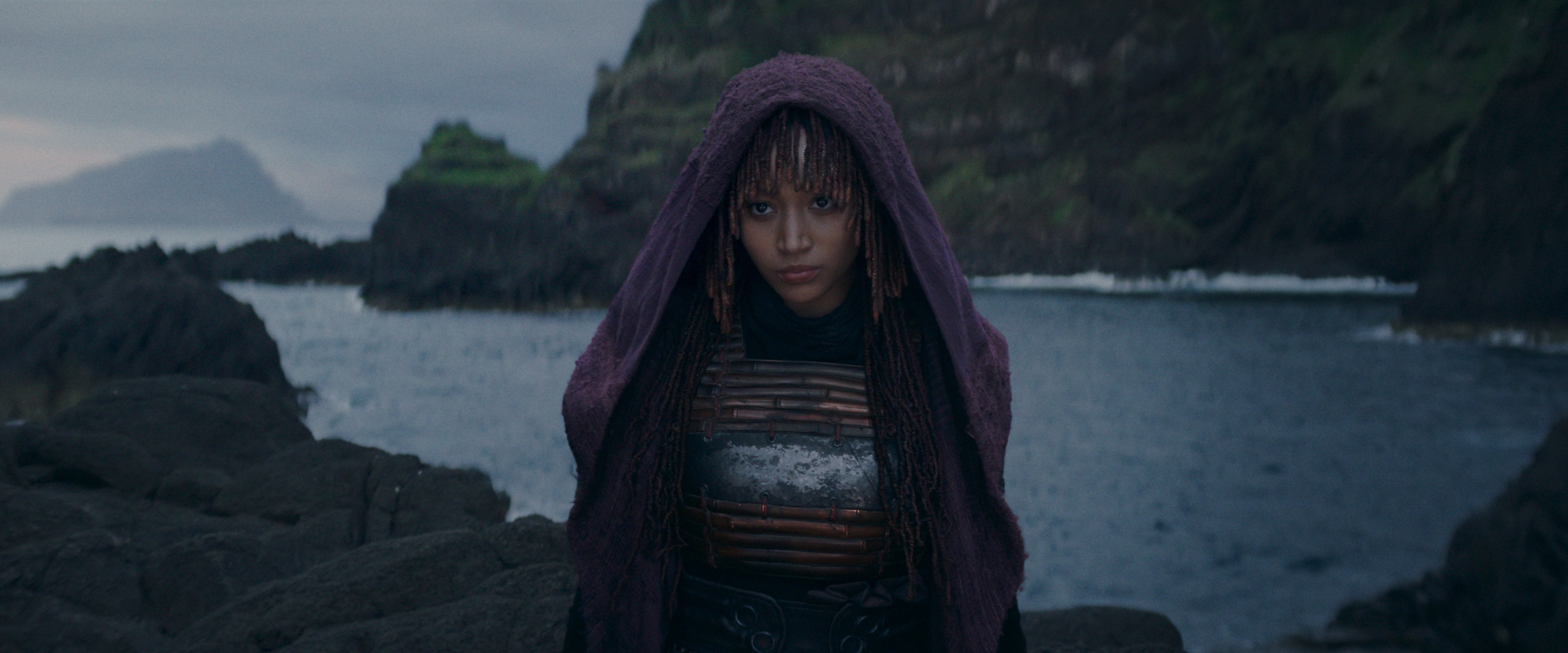 Amandla Stenberg standing in costume in a still from Star Wars: The Acolyte