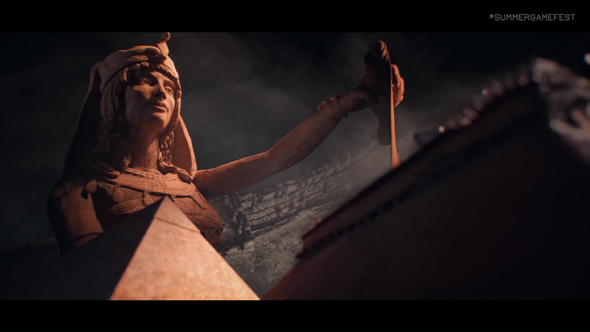 a statue of a woman in a headdress with a pyramid in front of her in Sid Meier’s Civilization 7