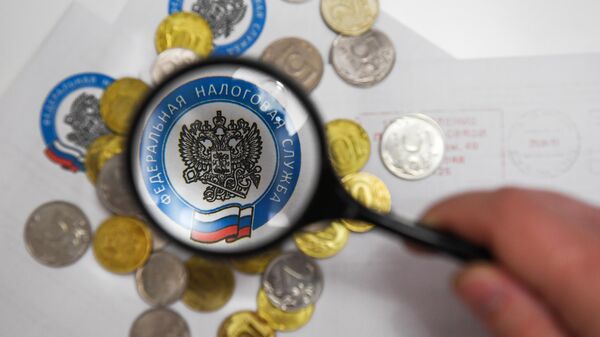Монеты России и конверты с логотипом ФНС