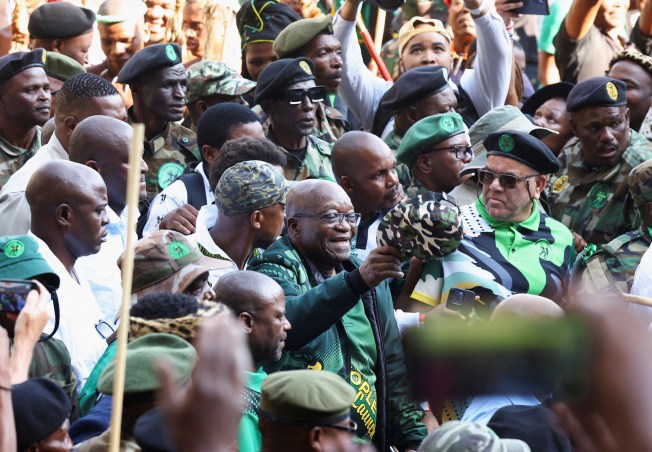 Former South African president Jacob Zuma arrives at a rally in Soweto on May 18, 2024, to launch the manifesto of his new political party, uMkhonto we Sizwe, ahead of South Africa’s May 29 general election. Men wearing military fatigues assaulted a number of of journalists at the rally. (Reuters/Siphiwe Sibeko)