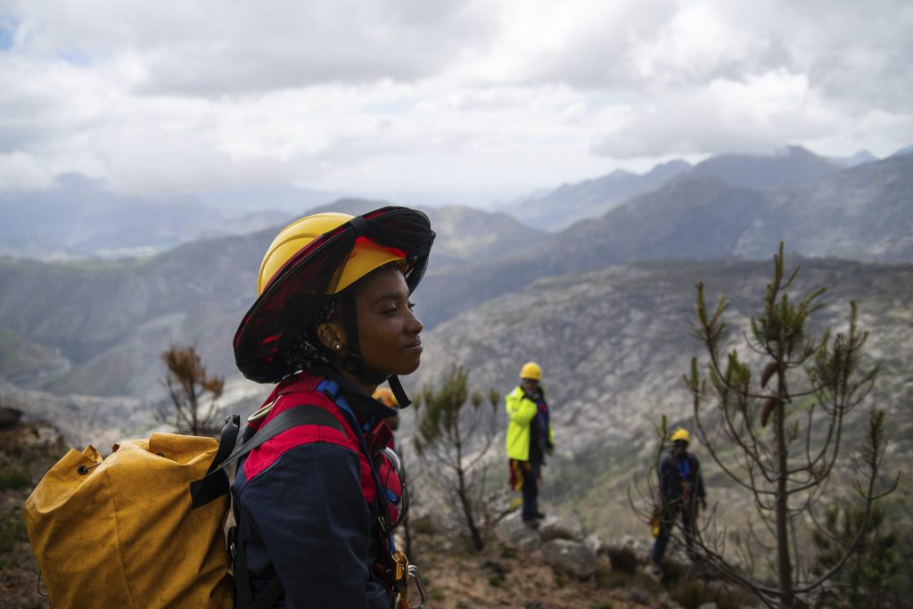Alungile Mayekiso scouts a cliff area in the Greater Cape Town watershed area.