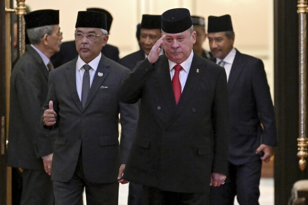Sultan Ibrahim Iskandar of Johor, second right, walks with Malaysia's King Sultan Abdullah Sultan Ahmad Shah, second left, after the election for the next Malaysian king at the National Palace in Kuala Lumpur Friday, Oct. 27, 2023. Malaysia's royal families have elected the powerful and wealthy ruler of southern Johor state as the country's new king under a unique rotating monarchy system, the palace said Friday. Sultan Ibrahim Iskandar, 64, will ascend to the throne on Jan. 31 for a five-year term. the palace said in a statement. (Mohd Rasfan/Pool Photo via AP)