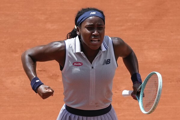 Coco Gauff of the U.S. celebrates winning her quarterfinal match of the French Open tennis tournament against Tunisia's Ons Jabeur at the Roland Garros stadium in Paris, Tuesday, June 4, 2024. (AP Photo/Thibault Camus)