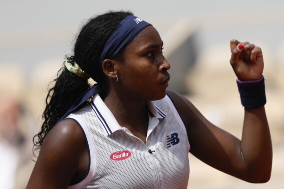 Coco Gauff of the U.S. clenches her fist after scoring a point against Tunisia's Ons Jabeur during their quarterfinal match of the French Open tennis tournament at the Roland Garros stadium in Paris, Tuesday, June 4, 2024. (AP Photo/Thibault Camus)