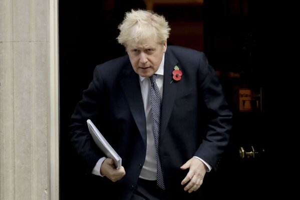 British Prime Minister Boris Johnson leaves 10 Downing Street in London, to attend a weekly cabinet meeting at the Foreign, Commonwealth & Development Office, in London, Tuesday, Nov. 10, 2020. (AP Photo/Matt Dunham)