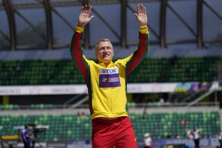 FILE - Silver medalist Mykolas Alekna, of Lithuania, celebrates during a medal ceremony for the discus throw at the World Athletics Championships, July 20, 2022, in Eugene, Ore. Alekna broke a world record in the discus throw that had stood since 1986 on Sunday, April 14, 2024, at the Oklahoma Throws Series competition. (AP Photo/Ashley Landis, File)