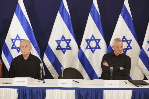 FILE - Israeli Prime Minister Benjamin Netanyahu and Cabinet Minister Benny Gantz attends a news conference in the Kirya military base in Tel Aviv, Israel, on Oct. 28, 2023. The departure of Gantz after eight months spent in Israel's war cabinet does not immediately appear to challenge government but does put pressure on Netanyahu. His resignation will likely embolden and empower Israel's radical ultranationalist cabinet ministers who have fiercely opposed all cease-fire deals. (Abir Sultan/Pool Photo via AP)