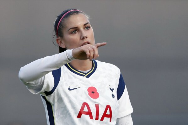 Tottenham Hotspur's Alex Morgan gestures to her teammates during the English Women's Super League soccer match between Tottenham Hotspur and Reading at the Hive stadium in London Saturday, Nov. 7, 2020. Morgan came on as a 69th minute substitute, the game ended in a 1-1 draw. (AP Photo/Alastair Grant)
