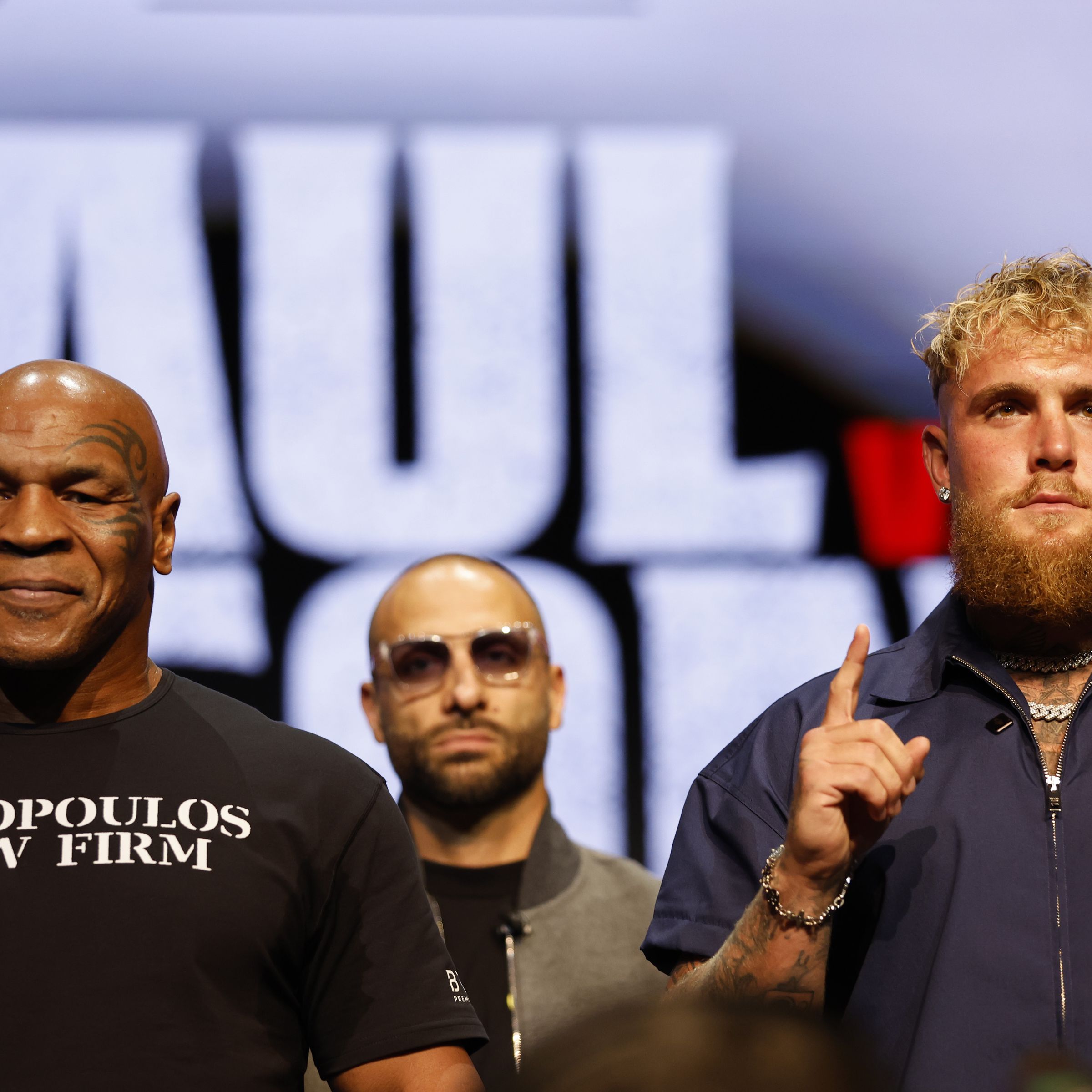 A photo showing Jake Paul and Mike Tyson at a press conference