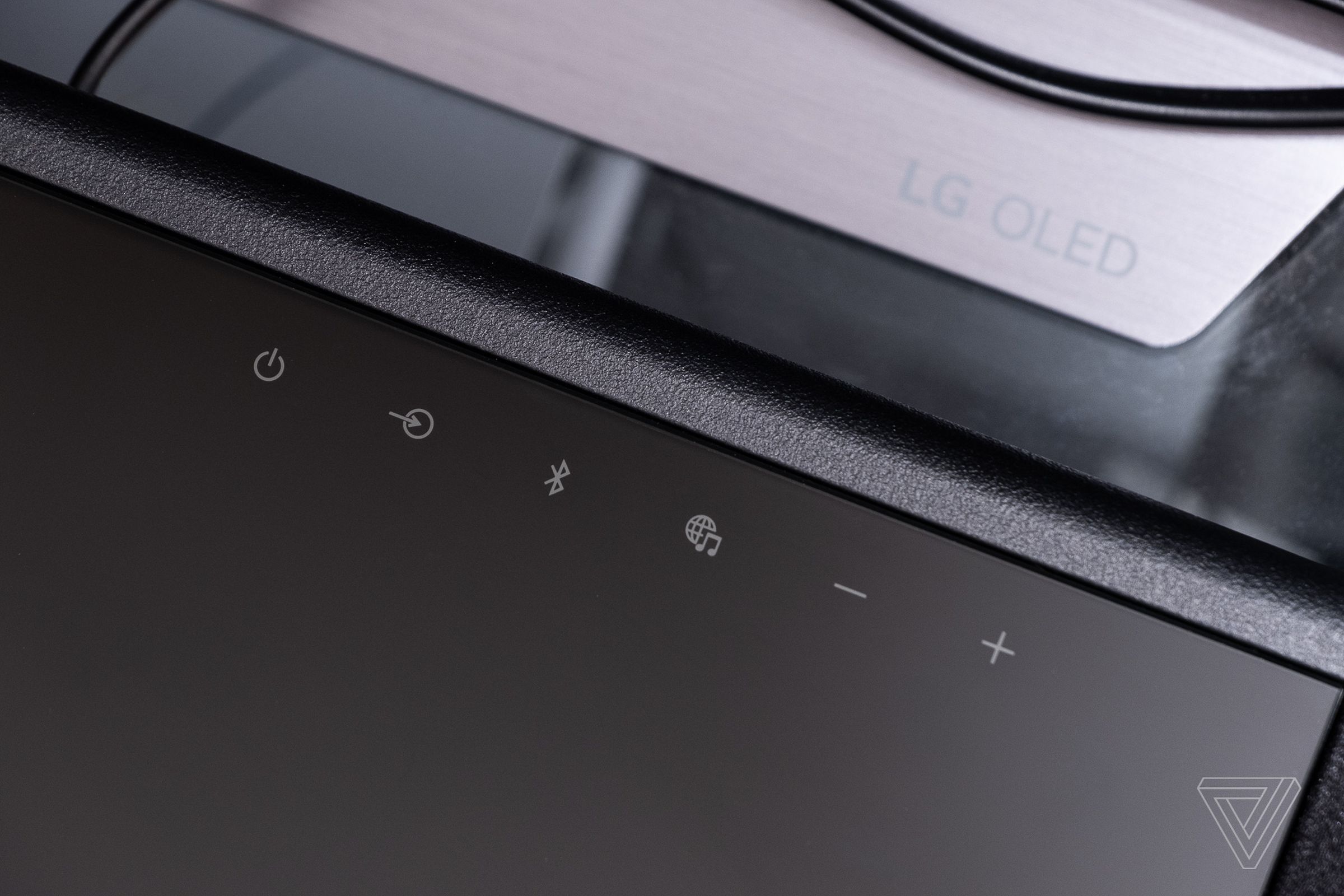 There are touch controls on the soundbar’s glass surface.