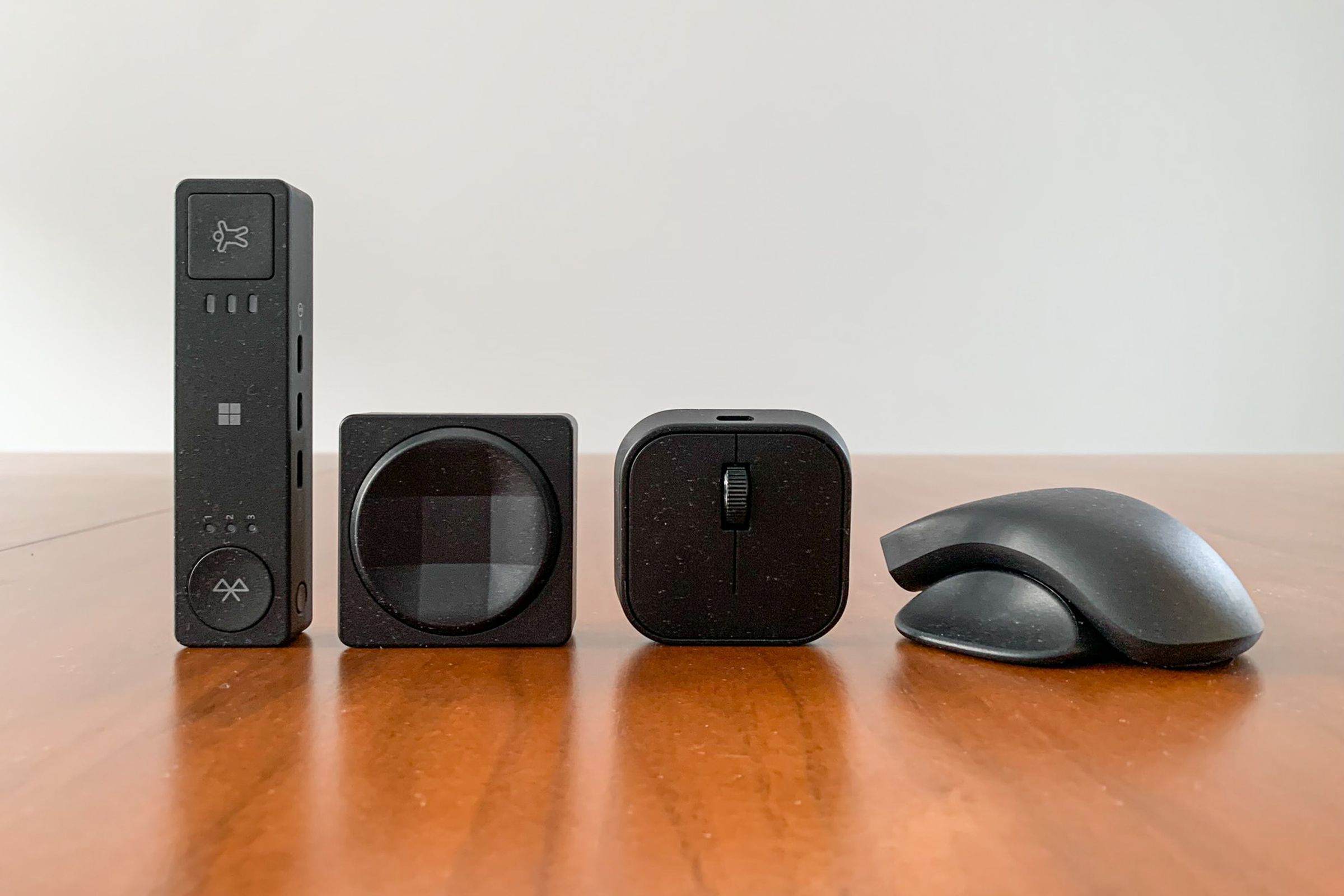 Lineup of Microsoft’s Adaptive Hub, Adaptive D-pad Button (both sides), and Adaptive Mouse with Adaptive Mouse Tail and Thumb Support.
