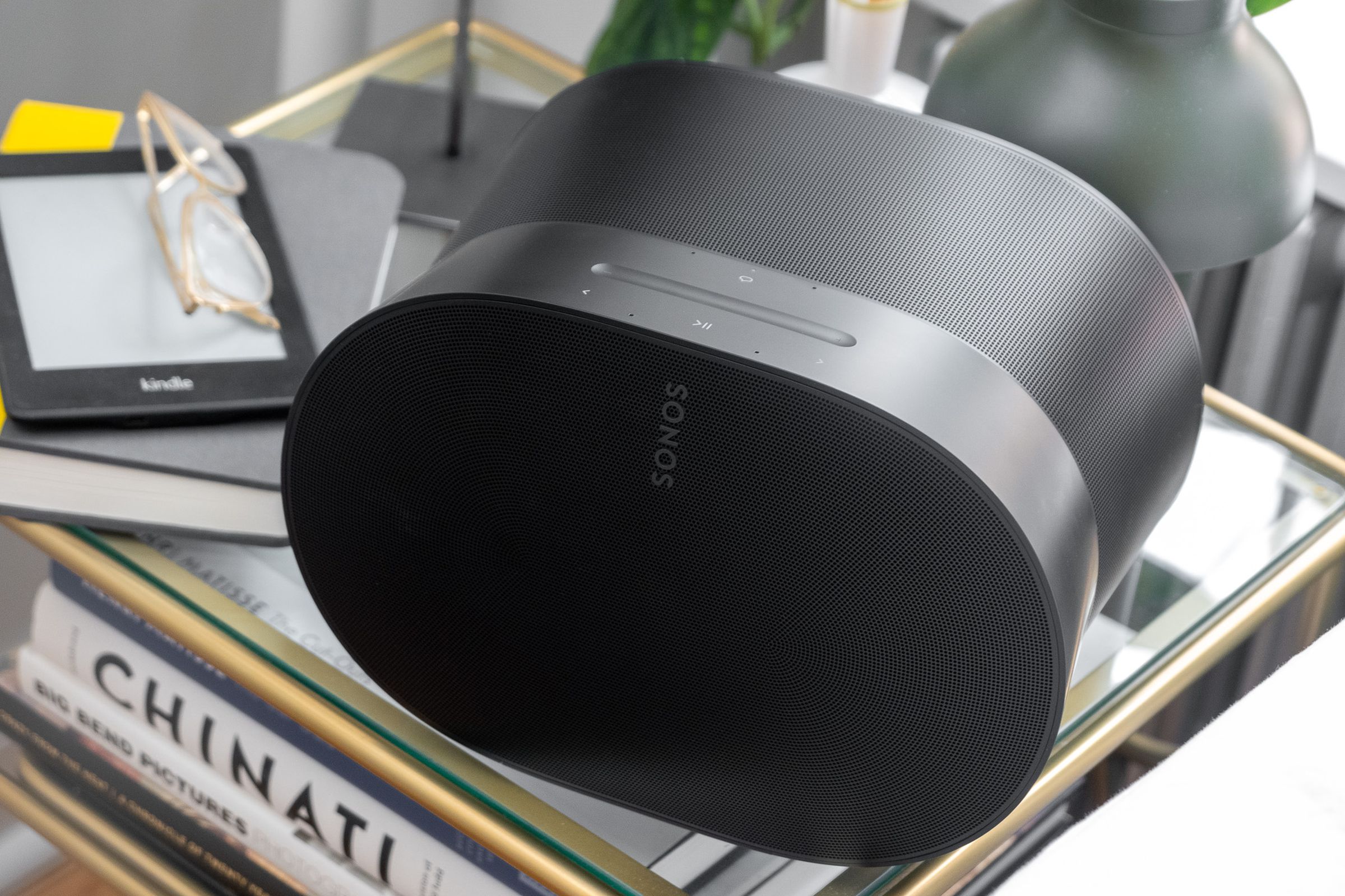 A photo of the Sonos Era 300 on a bedside table.