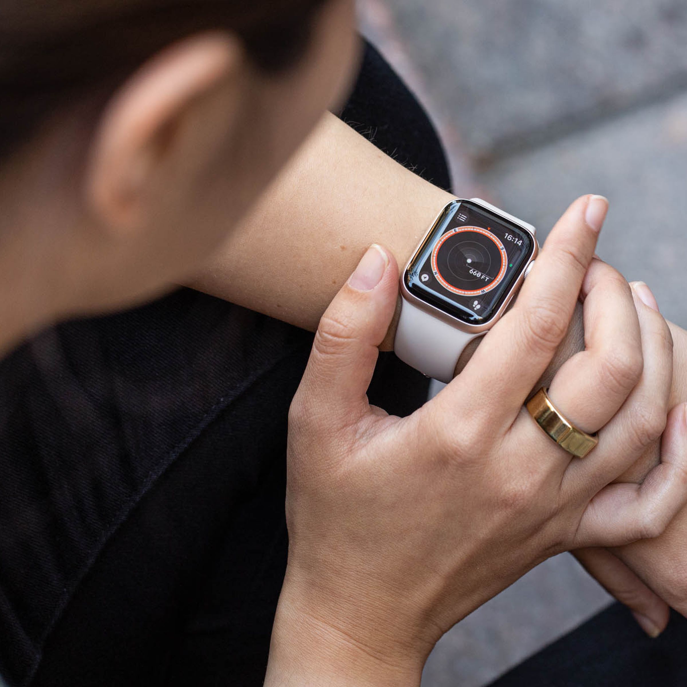 A person using an Apple Watch SE on their wrist.