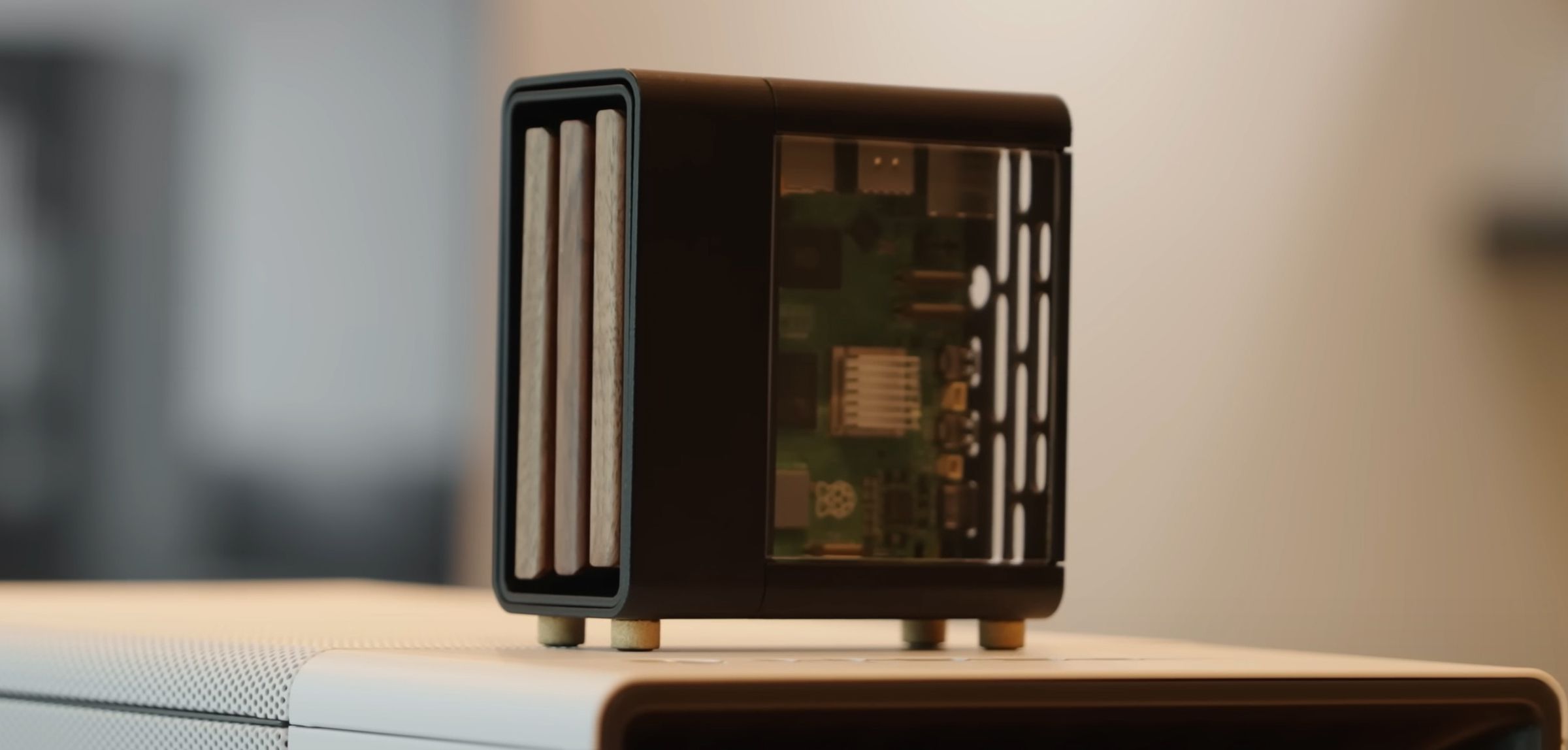 A miniature PC case with wood paneling on the front.